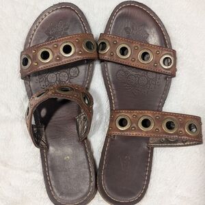 Elegant Brown Sandals with Grommet Accents